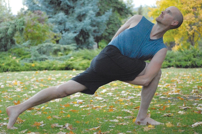 Woman doing Extended Side Angle Pose in Yoga - Fitness 1440