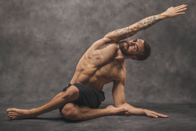 Cow Face with Side Bend - Man on the Mat - OM Yoga magazine