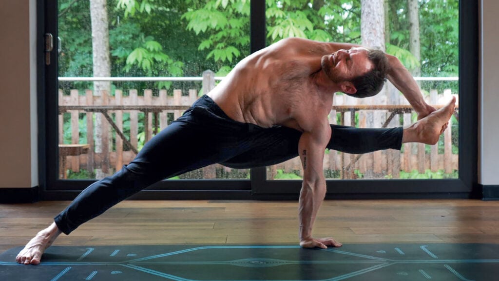 Man on the Mat - Flying Warrior Pose | Om Yoga Magazine