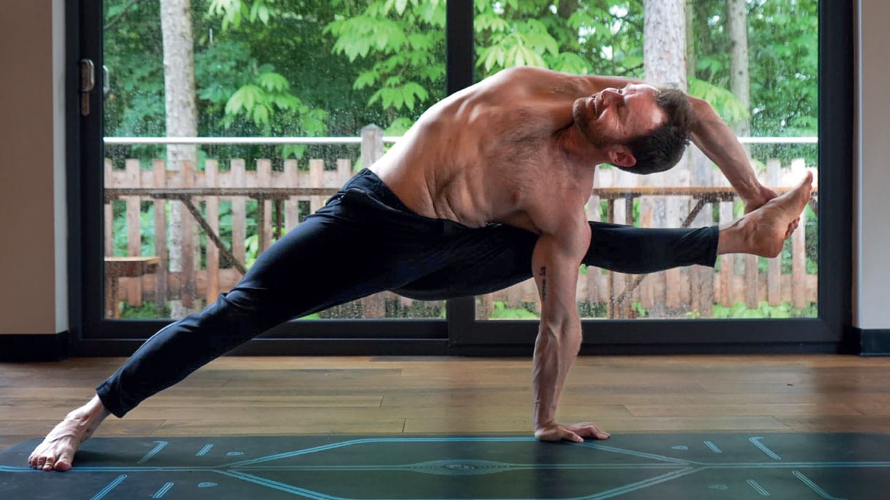 Man on the Mat - Flying Warrior Pose