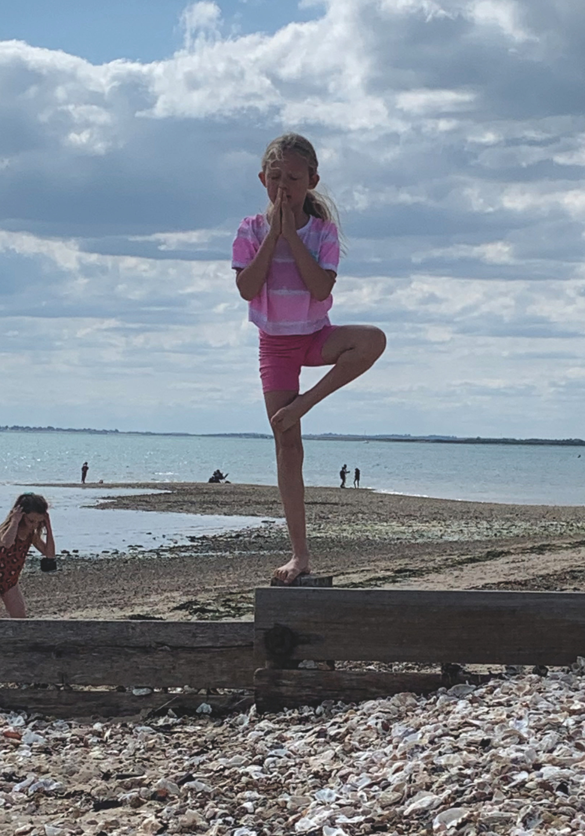 Helen Hughes’ granddaughter in tree pose, Mersea Island, Essex